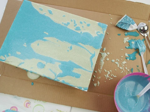 Allow excess sand paint to run off the edge of the canvas.  Allow to dry overnight.